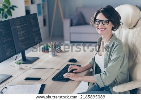 Photo of pretty smiling student girl practicing developing website young system administrator working in office