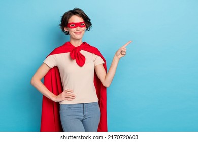 Photo Of Pretty Sweet Lady Dressed Red Mantle Pointing Finger Empty Space Isolated Blue Color Background