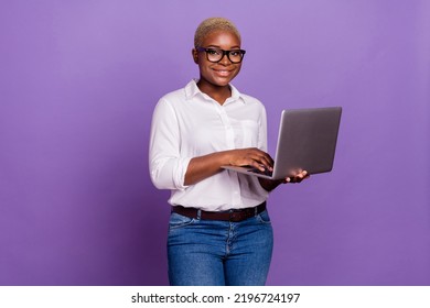 Photo of pretty sweet short hair lady wear smart casual look eyewear typing modern device isolated purple color background - Powered by Shutterstock