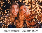 Photo of pretty young couple cheerful smile camera dressed christmas garment tradition atmosphere decor house indoors room