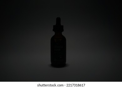 Photo Of Product Packaging Made From Glass Bottles With A Pipette With A Silhouette Lighting Technique