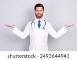 Photo of professional qualified doctor hold empty space scales wear white coat isolated on grey color background