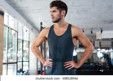 Photo In Profile Of Fitness Man In Gym. Looking Away