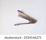 photo of purple staples on a white background. selective focus 