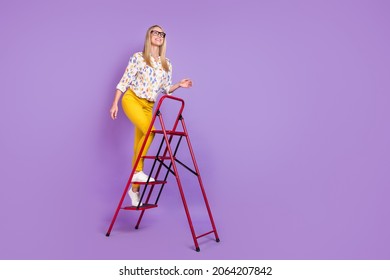 Photo of purposeful smart young woman wear print shirt spectacles smiling rising ladder looking empy space isolated violet color background