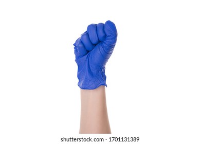 Photo of raised up clenched fist in protective latex glove isolated over white cutout color background