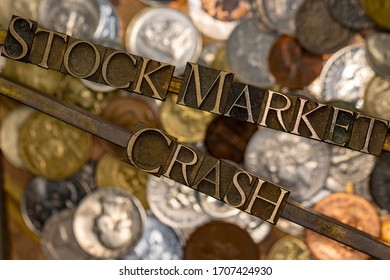 Photo Of Real Authentic Typeset Letters Forming Stock Market Crash Text Positioned On Bars Over Layer Of Coins On Vintage Textured Grunge Copper And Gold Background