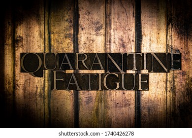 Photo Of Real Authentic Typeset Letters Forming Quarantine Fatigue Text On Vintage Textured Grunge Gold And Copper Background