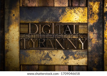 Photo of real authentic typeset numbers forming Digital Tyranny text with Roman numerals MMXX on vintage textured grunge copper and gold background