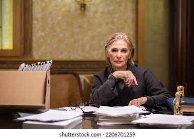 Photo Realistic Digital Collage Of Confident Mature Female Professional Sitting By Workplace And Working With Business Documents