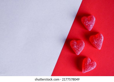 Photo Of Red Jelly Candy Hearts On Red And White Background