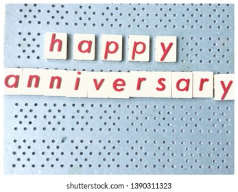 Photo Red Of Letters Spelt Happy Anniversary On Blue Peg Board With Copy Space For Text For Cards