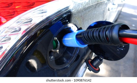 Photo Of Refuel LPG - CNG Hose In Car As Seen In Gas Station           