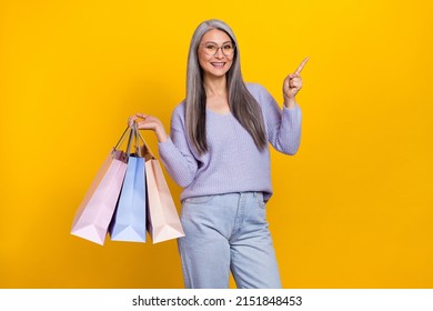 Photo Of Retired Mature Grandma Go Shopping Advert Black Friday Bargains Isolated On Yellow Color Background