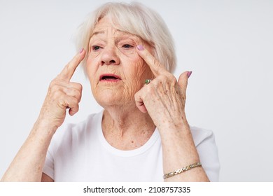 Photo of retired old lady vision problems myopia light background