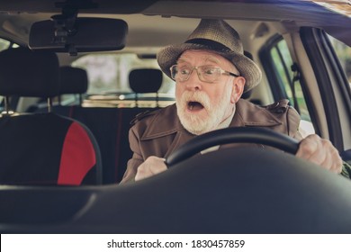 Photo Of Retired Old Man Surprised Face Open Mouth Drive Wear Brown Jacket Headwear Eyewear Inside Car