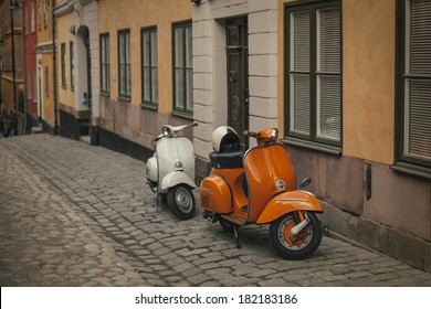 Photo retro scooters in the old town of Stockholm. Effect retro film - Powered by Shutterstock