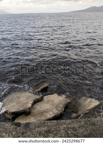 Photo of rocks on the edge of Bahu Beach, Manado City, North Sulawesi, Indonesia.