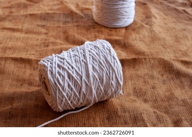 photo of a roll of thread used to sew a burlap sack