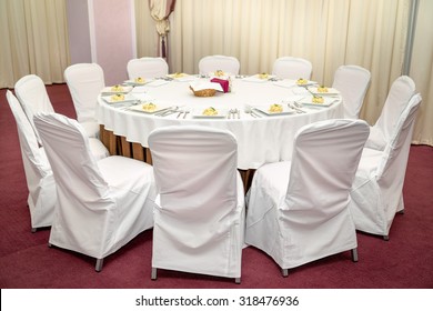 Photo Round Dining Table Served For Twelve People.