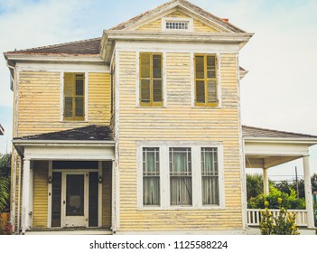 Photo Of Run Down Yellow House.