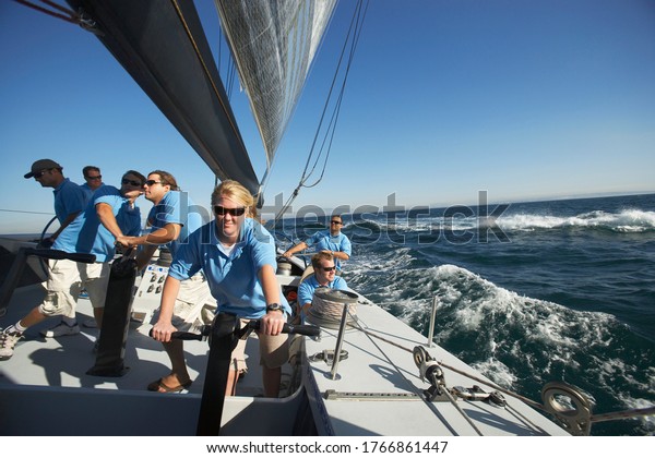 Photo of Sailing team on\
yacht
