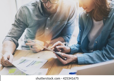 Photo Sales Manager Working Modern Studio.Woman Showing Market Report Digital Tablet.Account Department Work New Startup Project.Researching Process Wood Table.Horizontal.Burred Background.Film effect - Shutterstock ID 425341675