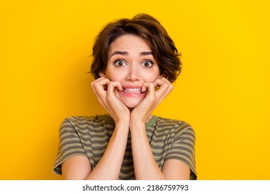 Photo Of Scared Horrified Lady Wear Striped T-shirt Biting Fingers Isolated Yellow Color Background