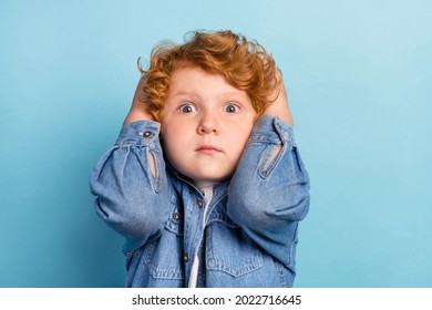 Photo Of Scared Nervous Guilty Ginger Kid Touch Head Speechless Wear Jeans Jacket Isolated Blue Color Background