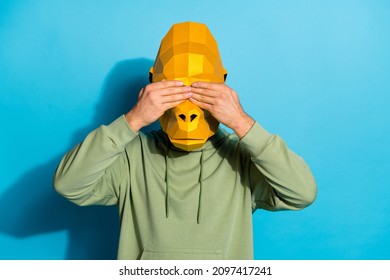 Photo Of Scared Upset Guy Dressed Wild Animal Mask Arms Cover Eyes Isolated Blue Color Background