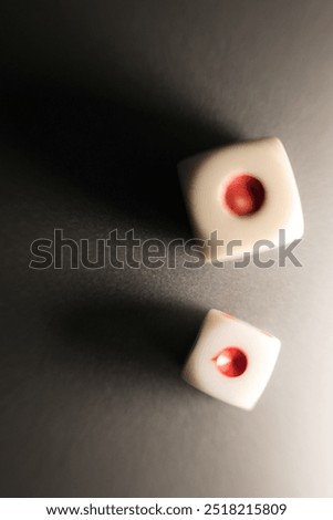 photo with selective focus and macro - two plastic game dice with the number one