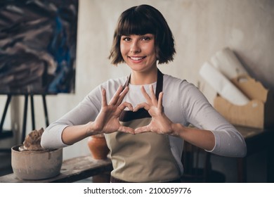 Photo of self-employed lady small store owner potter make heart shape enjoy life vocation hobby sit in workroom - Powered by Shutterstock