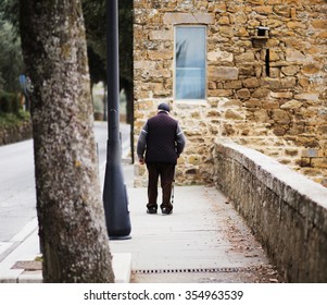 Photo Of Senior Man Walking With Cane At Park