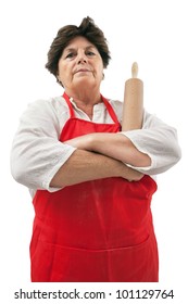 Photo of an senior woman with a rolling pin and disapproving glare.