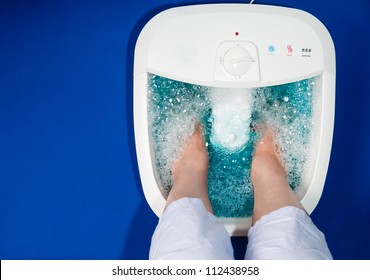 Photo of a senior women's feet in an electric foot spa