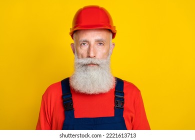 Photo Of Serious Confident Age Man Workwear Uniform Red Hard Hat Isolated Yellow Color Background