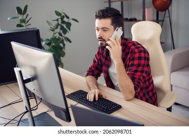 Photo Of Serious Focused Young Man Write Computer Programmer Hold Phone Talk Indoors Inside Office Workplace