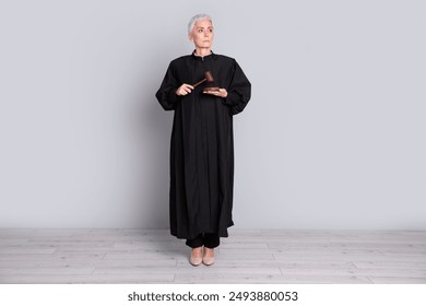 Photo of serious old woman judge hit wooden gavel look empty space isolated grey color background - Powered by Shutterstock