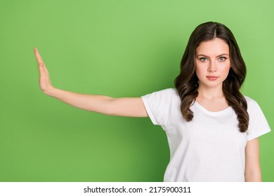 Photo Of Serious Pretty Woman Dressed White T-shirt Showing Palm No Gesture Isolated Green Color Background