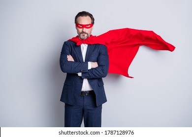 Photo Of Serious Self-confident Cool Professional Aged Mature Business Guy Arms Crossed Corporate Party Theme Super Hero Costume Wear Blue Suit Red Face Mask Cloak Isolated Grey Background