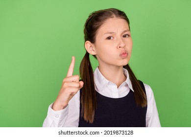 Photo Of Serious Strict School Girl Dressed Formal Clothes Pointing Finger Isolated Green Color Background