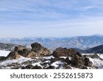 Photo of the Seven Devils Mountain area near Riggins ID in the winter on a sunny day with blue sky