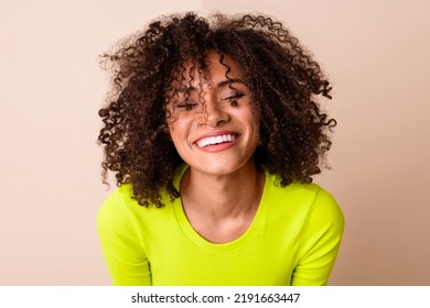 Photo Of Shiny Adorable Girl Dressed Neon Shirt Smiling Laughing Isolated Beige Color Background