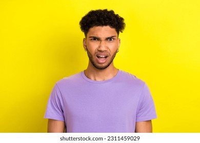 Photo of shocked confused guy dressed purple t-shirt open mouth isolated yellow color background - Shutterstock ID 2311459029