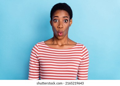 Photo Of Shocked Funny Cute Lady Look Camera Open Mouth Omg Face Wear Striped Shirt Isolated Blue Color Background