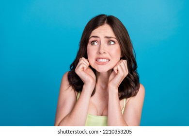 Photo Of Shocked Scared Lady Wear Green Outfit Looking Empty Space Isolated Blue Color Background