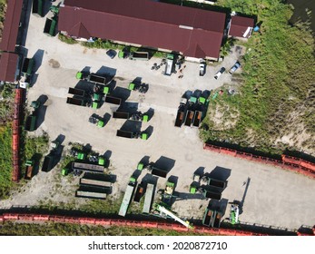 The Photo Showing An Aerial Of Heavy Equipment Yard Such As Tractor, Truck, Forklift At Industrial Park Of Malaysia, Southeast Asia.