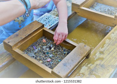 A Photo Showing A Child's Hand Using A Gold Sifter Panning For Gold And Gems A Great Educational Outdoor Acitivity With Kids