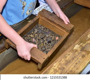 A Photo Showing A Child's Hand Using A Gold Sifter Panning For Gold And Gems A Great Educational Outdoor Acitivity With Kids