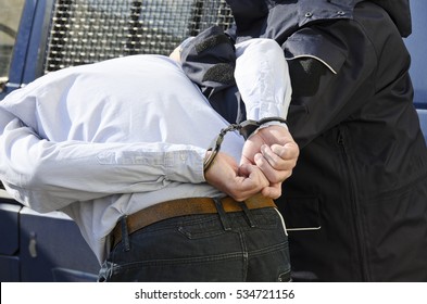 The Photo Shows The Arrest Of A Man.